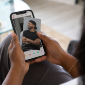 a black woman's hands holding a phone with a dating app open, showing the difficulty autistic people have with dating apps